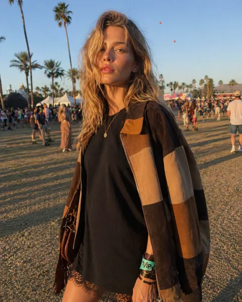Coachella Candid Style outfit featuring patchwork jacket and black lace dress