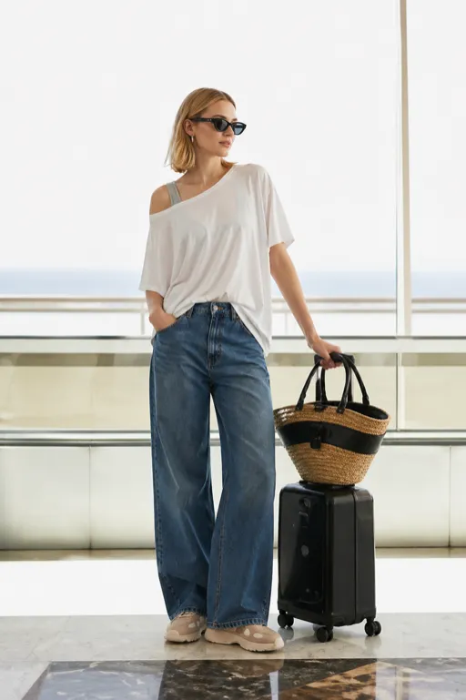 Oversized Tee Layover travel outfit featuring a slouchy tee and jeans