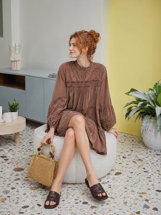 Modern Indoor Editorial Look featuring a light blue smock dress, woven bag, and white sneakers.