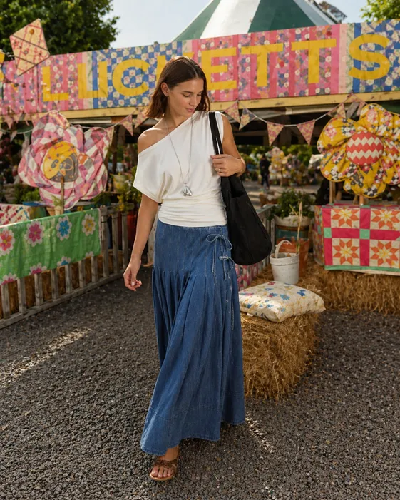 Soft Spring Market Walk outfit featuring a denim midi skirt, white tank top, and black canvas tote bag.