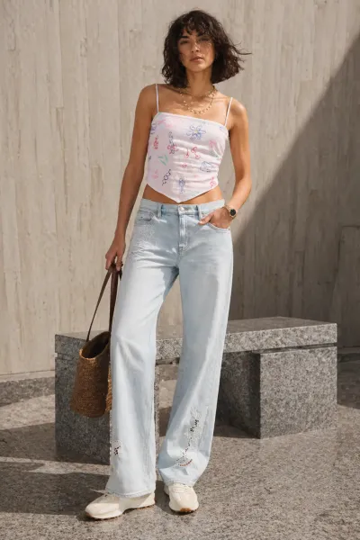 Sun-Kissed Denim Ease outfit featuring white top and embroidered jeans