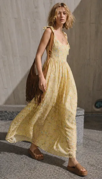 Sunlit Floral Flow outfit featuring yellow floral dress and fringe bag